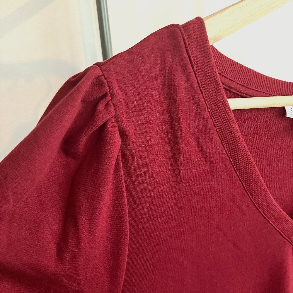 Burgundy v-neck sweatshirt with short sleeves and shoulder detail